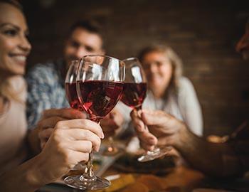 Friends drinking red wine together