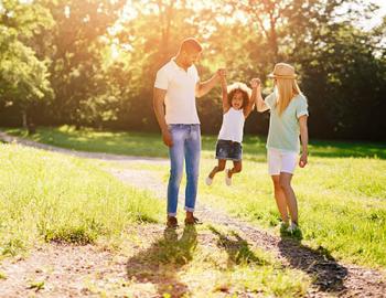 Young Family Playing in Park