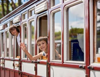 kids riding a trolley