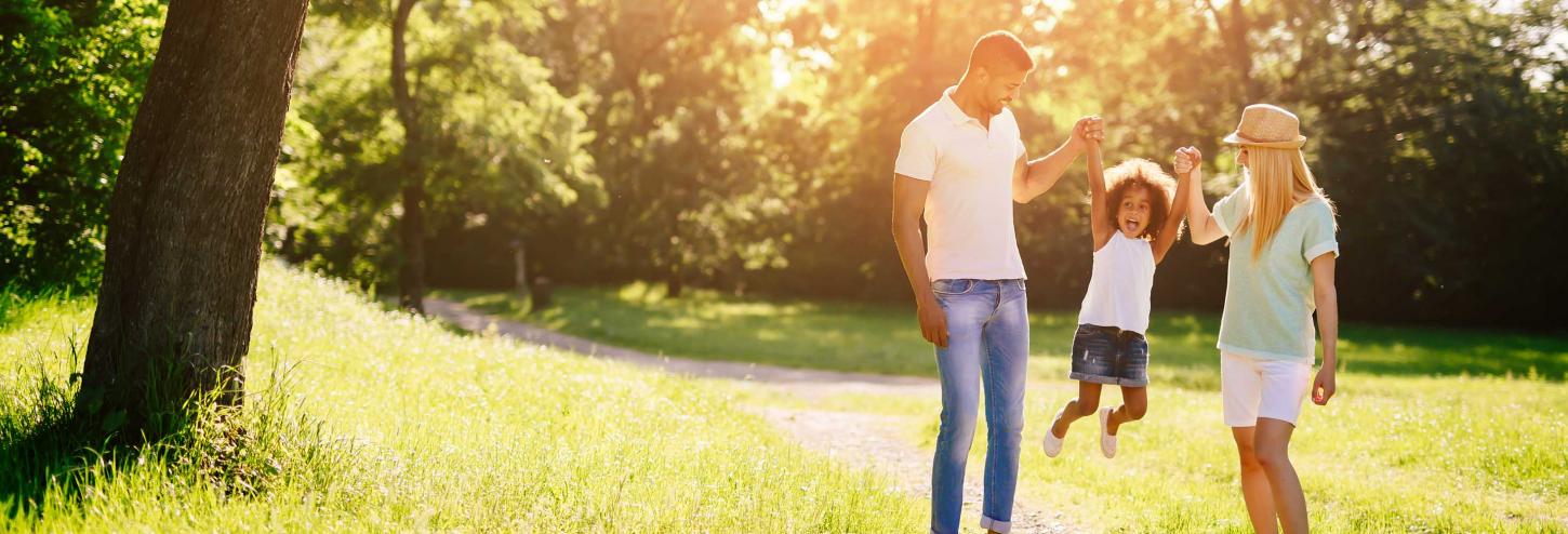 Family holding hands at live music event